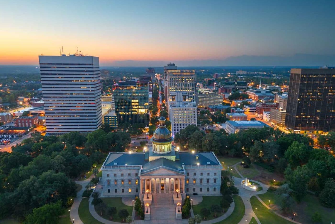 The South Carolina State House and downtown Columbia skyline at dusk